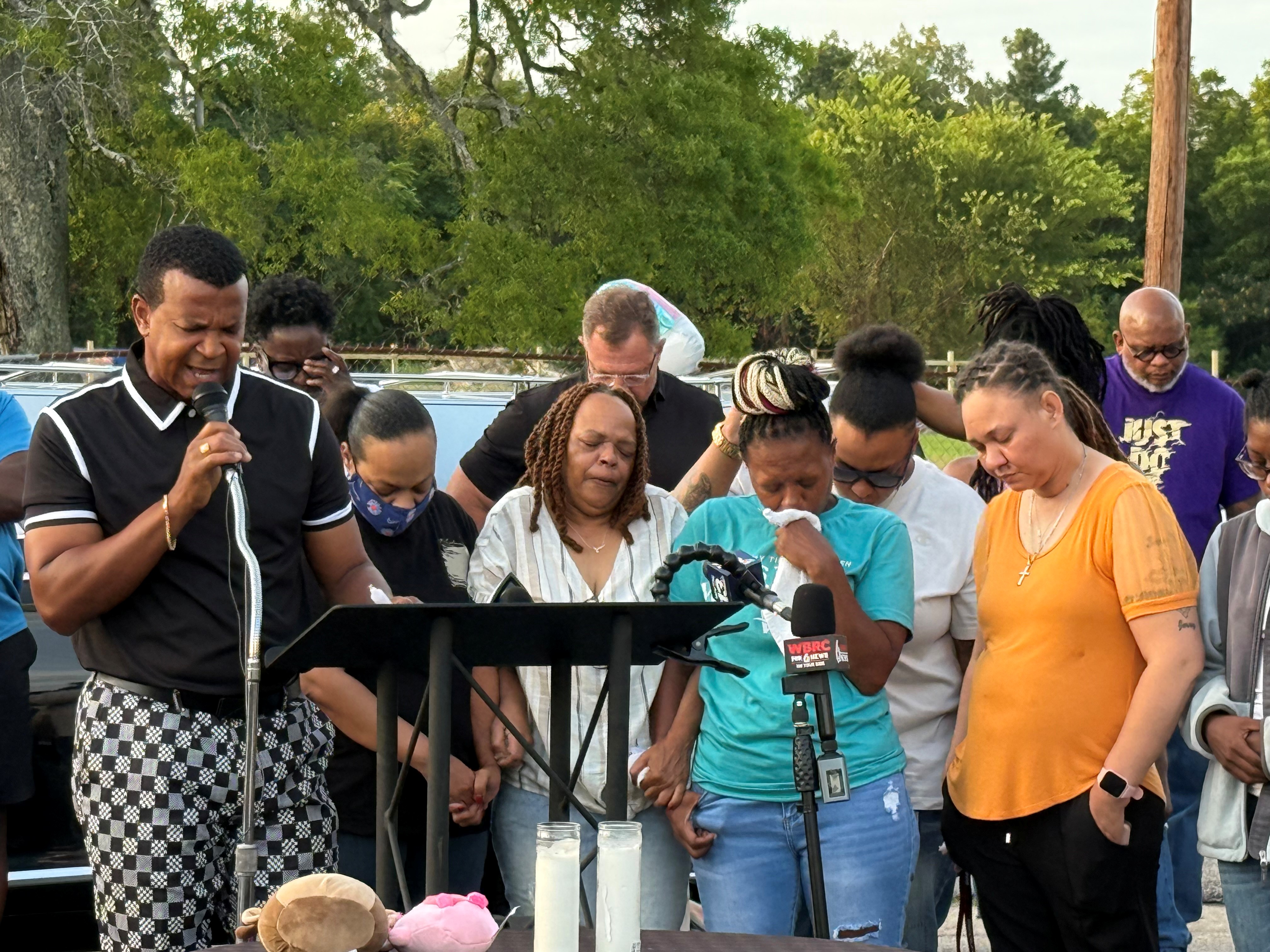 About 100 people gathered Sunday, Aug. 10, 2025, in Gadsden, Ala., to pray for the family of Blessence Pearl, a one-year-old girl whose body was found inside a hearse Saturday.